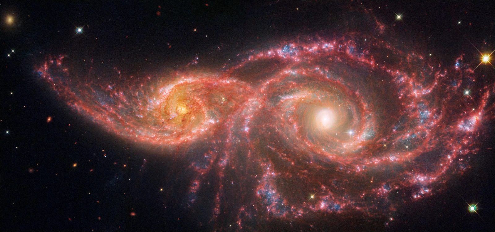 The 2024 Hubble and Webb composite of interacting galaxies IC 2163 and NGC 2207, seen in the direction of CANIS MAJOR. A small telescope field within that constellation, not a view of the entire constellation.